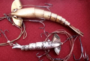 A pair of James Gregory Patent flexible baits.